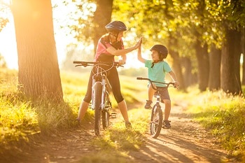 Woman and child riding bikes