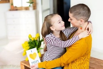 Mom and daughter embracing