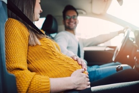 Happy couple in car