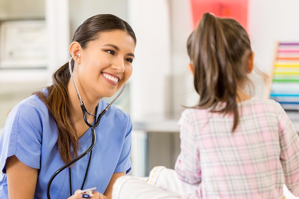 Nurse caring for a child patient