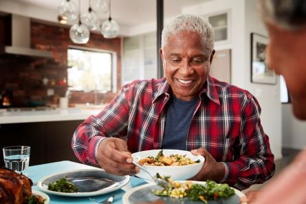 man getting a serving of food