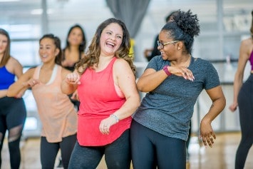 Women exercising and dancing.