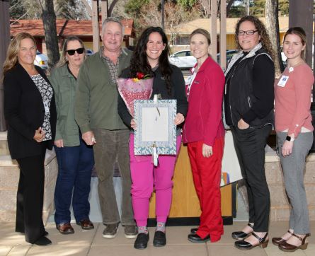 Amy Yurus accepts her Stories of Excellence award