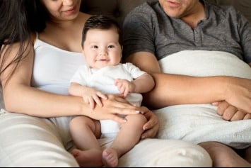 Couple enjoying time with their baby.