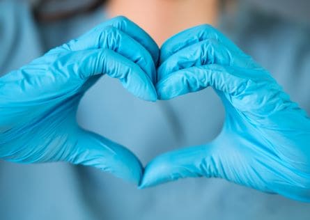 caregiver making a heart