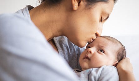 Happy mother with newborn baby