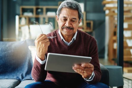 man looking at tablet