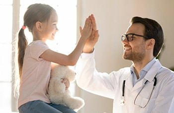 Resident and child high fiving