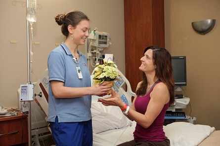 A junior volunteer helping out a patient