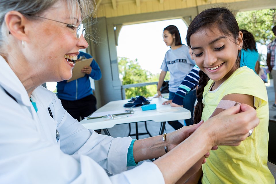 Caregiver giving a flu shot