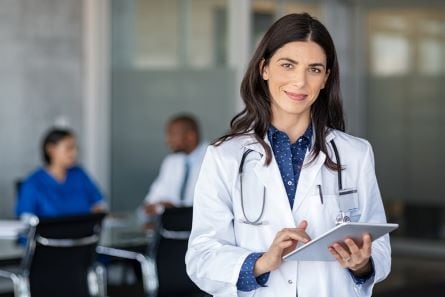 caregiver holding a clipboard