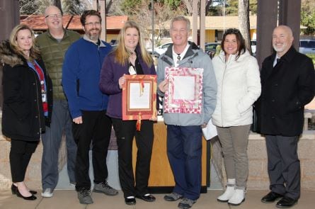 Angie McClellan accepts her Stories of Excellence award