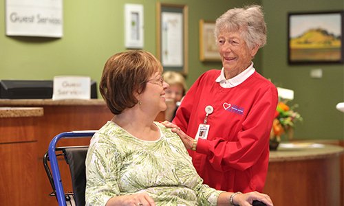 Enloe Health volunteer with patient