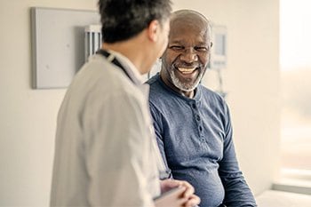 Patient smiling at doctor