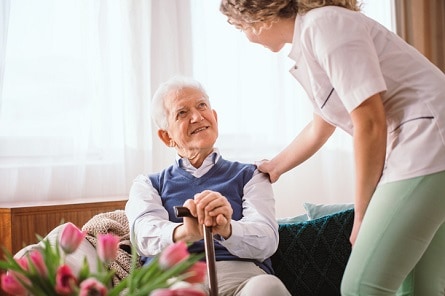 Hospice volunteer with patient