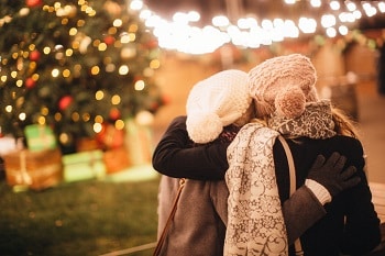 Women at Christmas tree