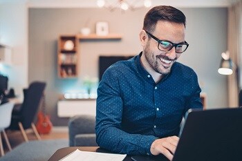 Happy remote employee at computer