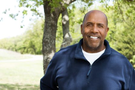 an adult volunteer smiling